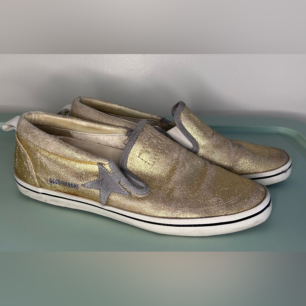Golden Goose slides in metallic gold with grey accents